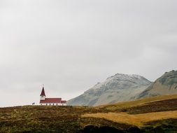 chapel building in rural mountain landscape, iceland