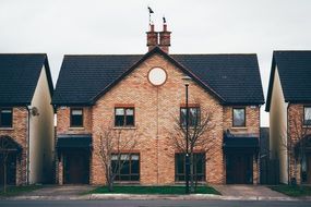 new red brick house with tile roof