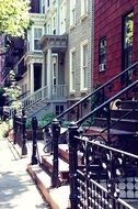 forged fence at stairs to building, usa, new york, brooklyn