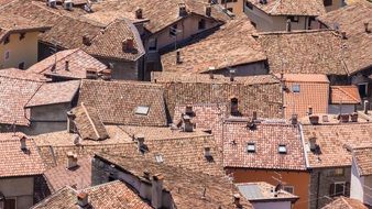 red tiled roofs on houses in old town, italy