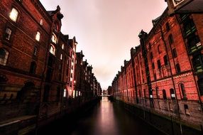 old red brick buildings in waterline at evening, germany, hamburg