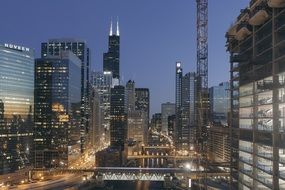 sears and willis towers in night cityscape, usa, illinois, chicago