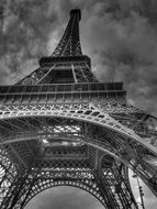 bottom view of eiffel tower at cloudy sky, france, paris