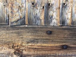 nails in weathered wooden wall