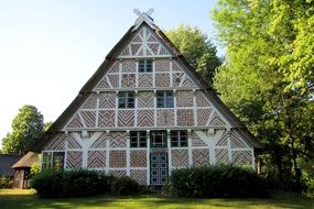 beautiful ornamented timber framed farmhouse at summer, germany