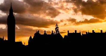 london landmarks silhouettes at golden evening sky, uk, england