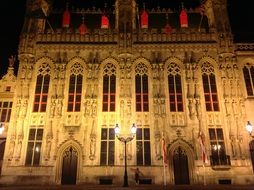 night view of medieval building facade, belgium