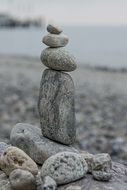 pile of grey stones at sea