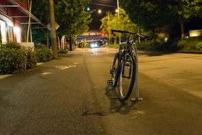 locked bicycle at night