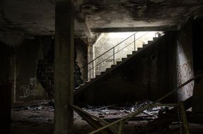 stairscase in interior of ruined abandoned building, france,