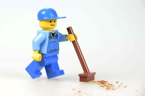 worker with push broom, lego blocks, toy