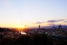 distant view of city at sunset, italy, florence