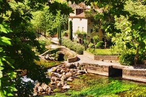 Bridge and house in a forest in France