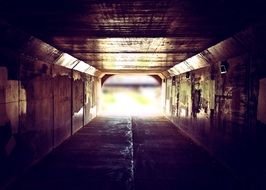 grunge tunnel with light at entrance