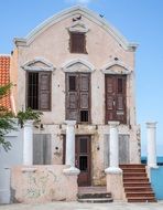 old abandoned building with columns at facade, netherlands, curacao, willemstad