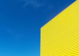 yellow wall at blue sky