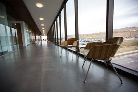 chairs table big windows relax area parking roads day view