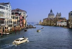 boats on grand canal in view of Santa Maria della Salute church, italy, venice