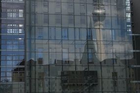 tv tower mirroring on glass facade, germany, berlin