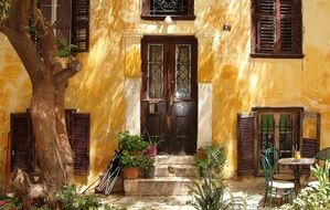 picturesque yellow facade of old house, greece, athens