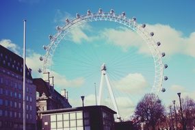 the london eye ferris wheel at sunny day in uk, england