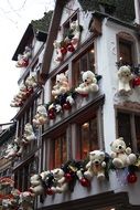 christmas decoration with white teddy bears on facade, france, strasbourg