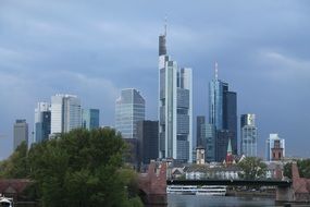 skyline of business district at clouds, germany, frankfurt, mainhattan