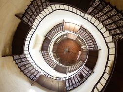 deep spiral staircase with forged steps in Granitz Hunting Castle, germany, Binz