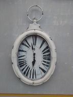 vintage oval hanging clocks on wall