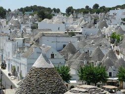 roof view of trulli, dry stone huts with a conical roof, in old town, italy, alberobello