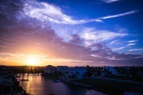 colorful sunset sky above florida canal, usa