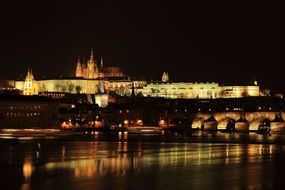 prague night castle lights city river reflection