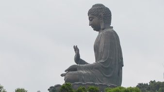buddha statue at grey sky, china, hong kong