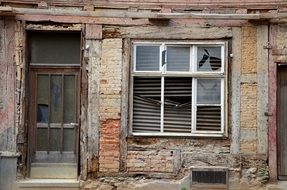 old demolition house with broken window