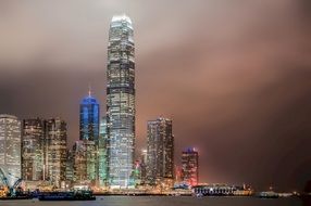 stormy cloudy sky above skyscrapers at night, china, hong kong