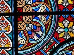 colorful pattern of stained glass window in basel cathedral, switzerland