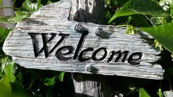 weathered wooden welcome sign, garden decoration