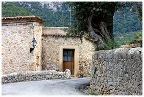 path to door of old stone building, spain, mallorca