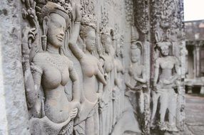 stone carved sculptures of angkor wat temple, cambodia