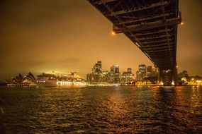 night cityscape with cruise ship at opera house, australia, sydney