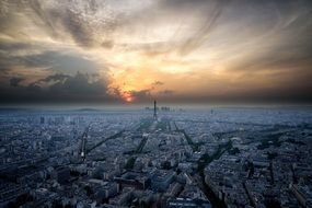aerial view of paris under colorful sky at sunset, france