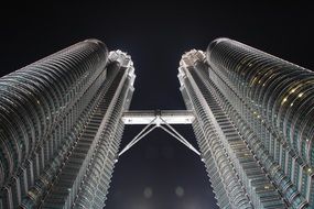 bottom view of skyscraper at night in malaysia