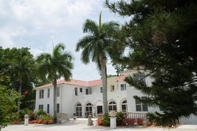 old building of shangri la hotel in park with colorful plants, usa, Florida, Bonita Springs