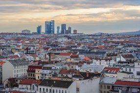 colorful roofs of city at evening, austria, vienna