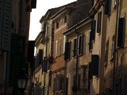 windows with shutters on old facade, croatia, rovinj