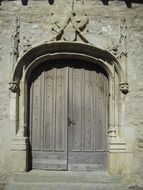 wooden door in medieval gateway
