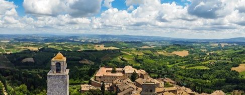 gorgeous panorama of old city at green countryside, italy, tuscany, san gimignano