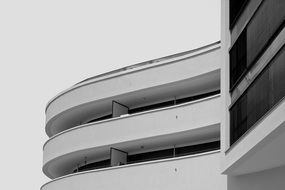 white curved facade, low angle shot