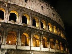 illuminated colosseum lfacade at night, italy, rome