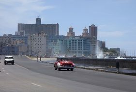 sea surf wave splash at road in city, cuba, havana